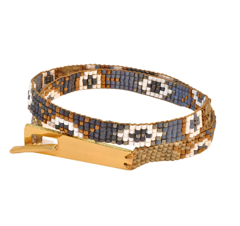 Beaded bracelet with a gold clasp on a white background