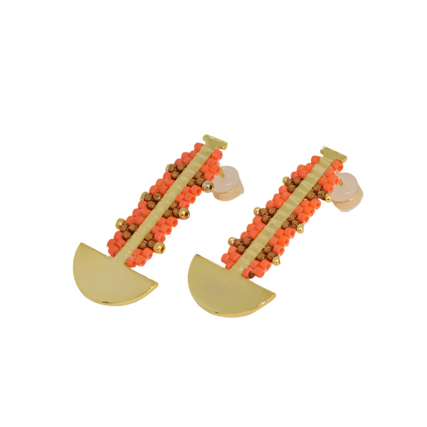 Pair of earrings with gold and orange beads on a white background