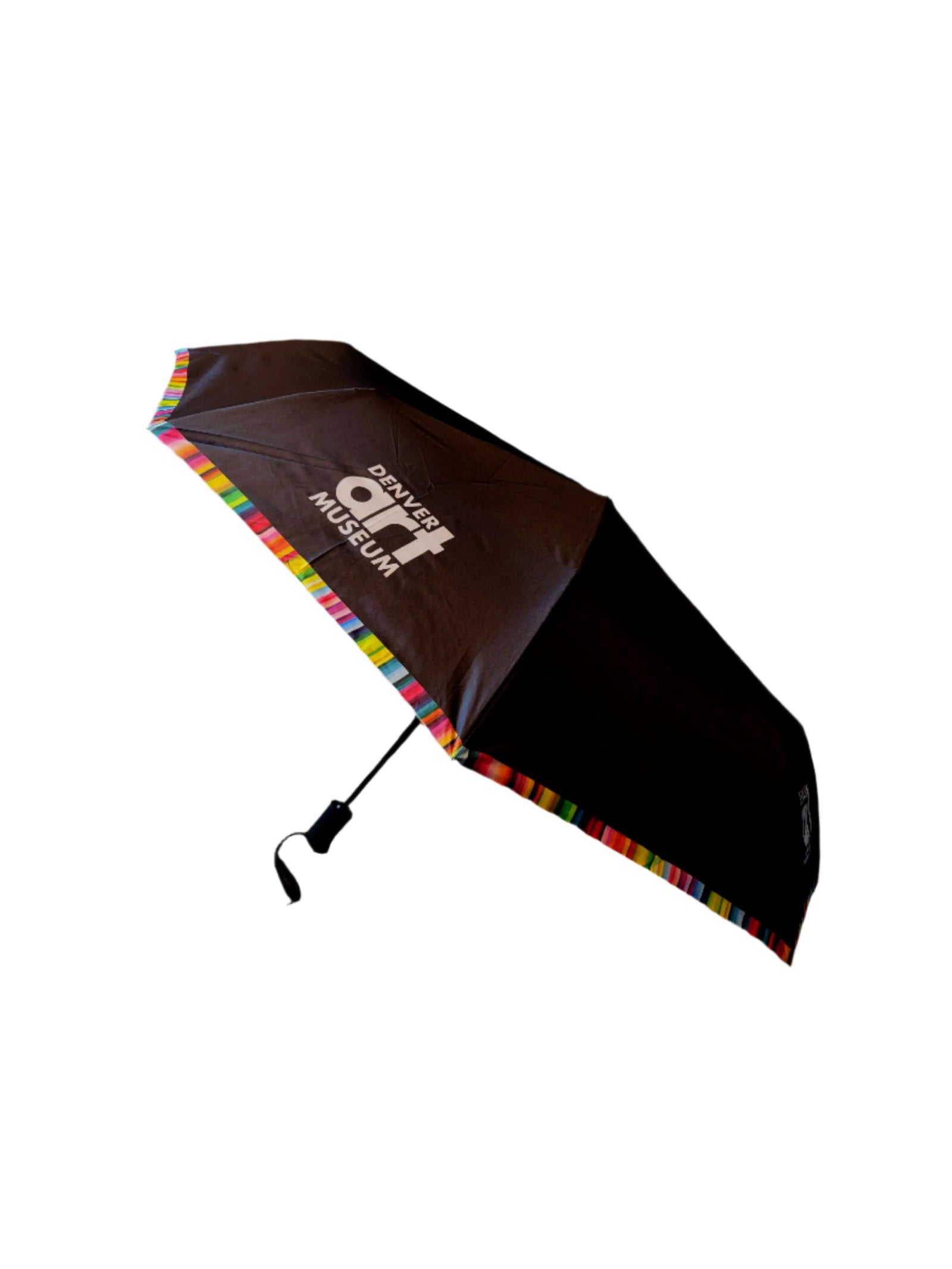 A black travel umbrella with rainbow-colored trim, featuring the Denver Art Museum logo.