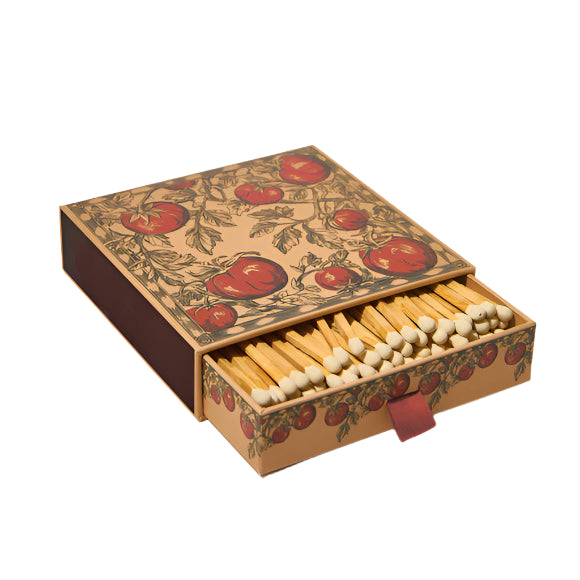 Matchbox with decorative design featuring tomatoes on a white background