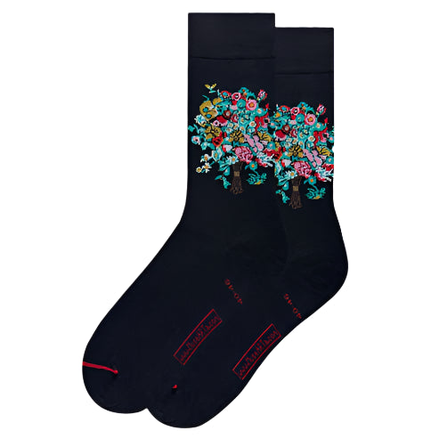 Black sock with floral design on a white background