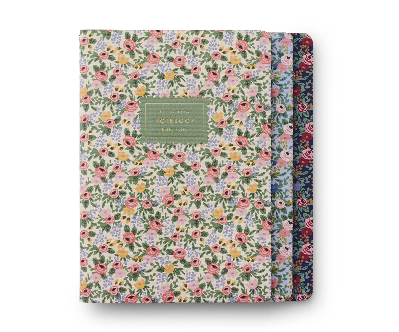 Three floral notebooks with a green label on a white background