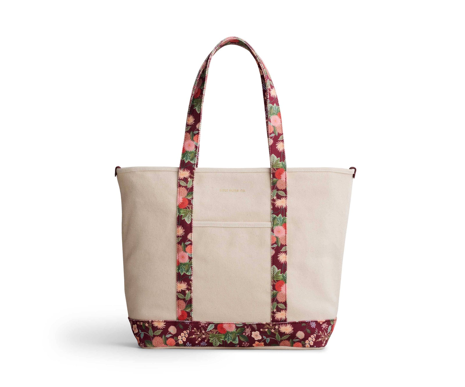 Beige tote bag with floral patterned handle and base on a white background