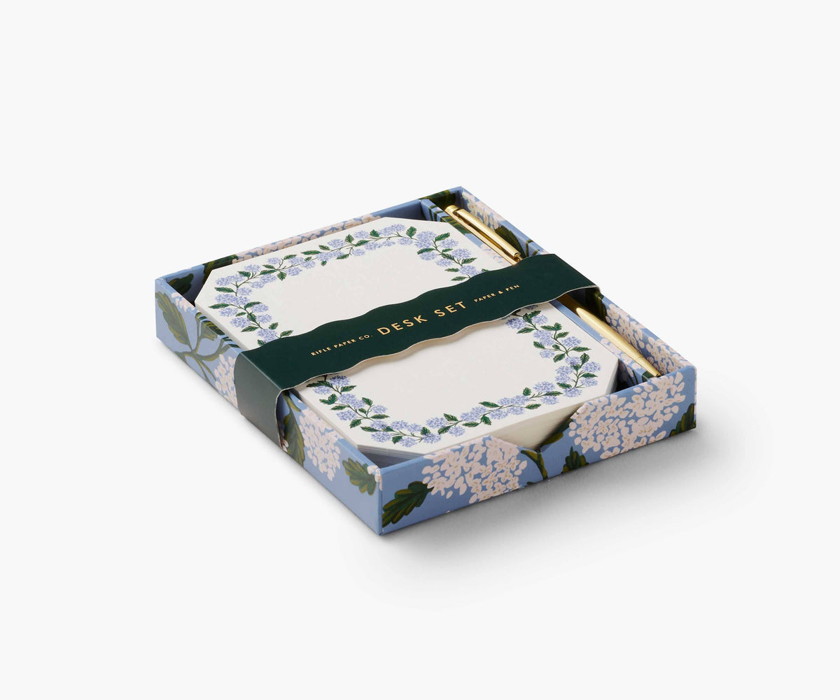 Floral desk set with notepad and pen in a decorative box on a white background