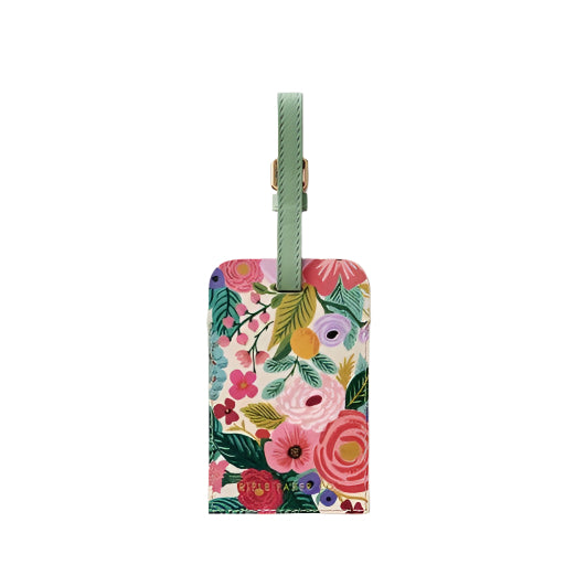 Floral-patterned luggage tag with a green strap on a white background