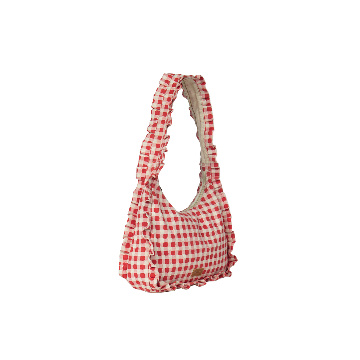 Red and white checkered bag on a light beige background