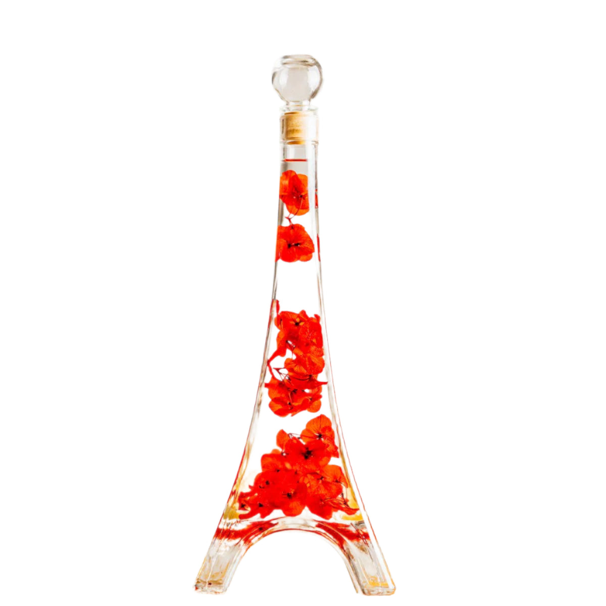Decorative glass bottle in the shape of the Eiffel tower with red floral design