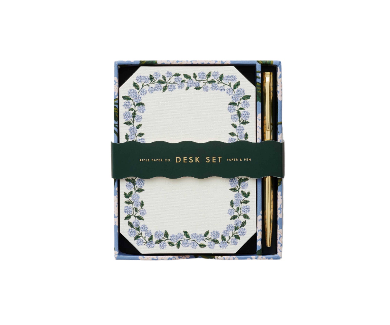 Notepad with floral border desk set with gold pen on a white background