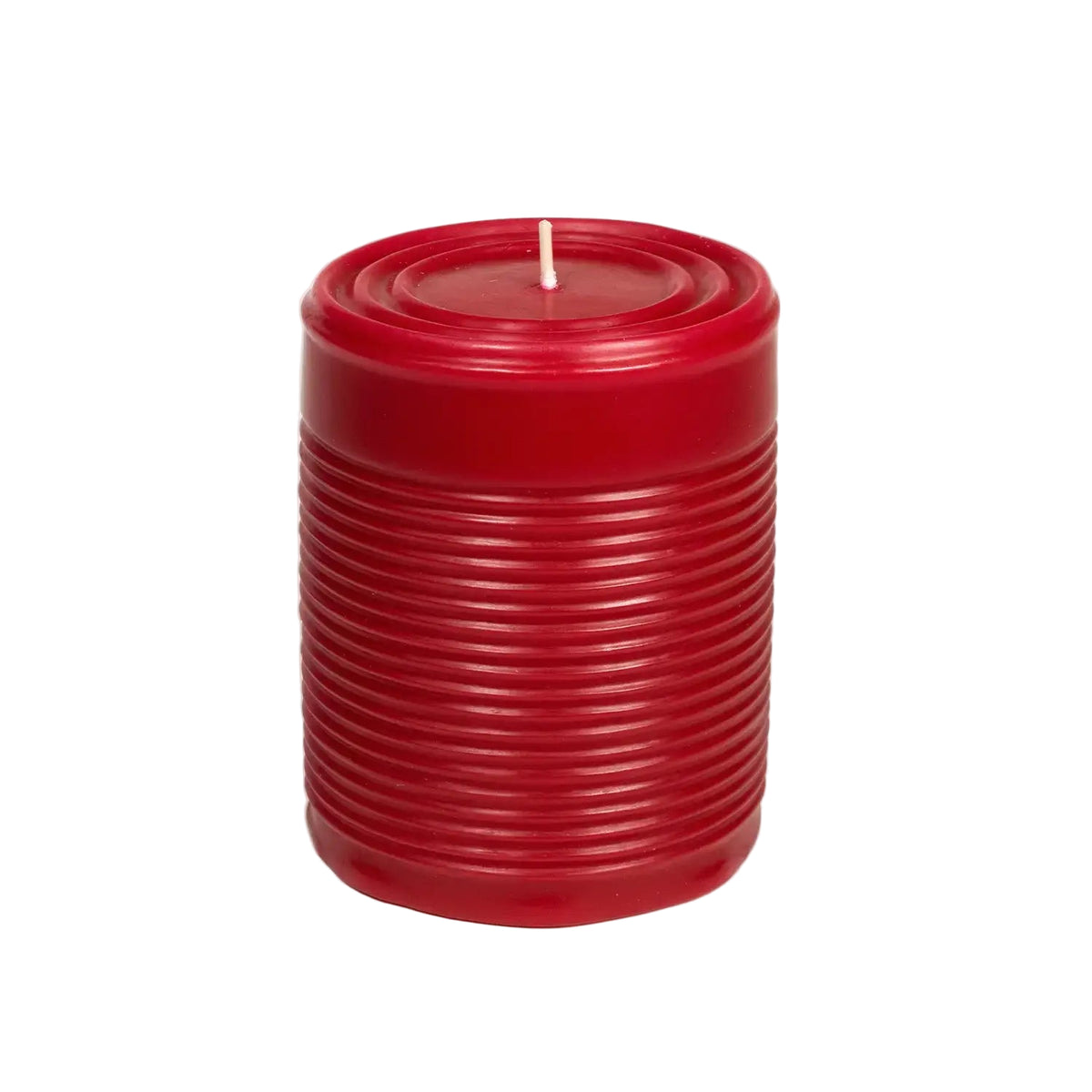 Red ribbed candle on a white background