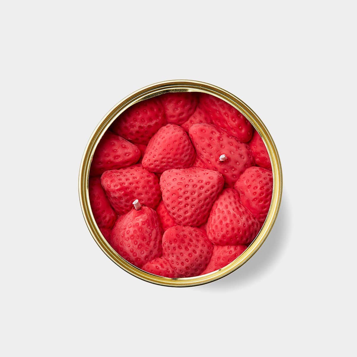 Can of strawberries candle on a light gray background