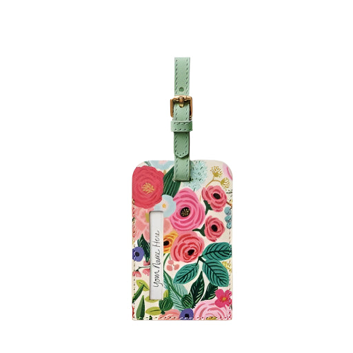 Floral luggage tag with a green strap with an opening with text that says "Your Name Here" on a white background