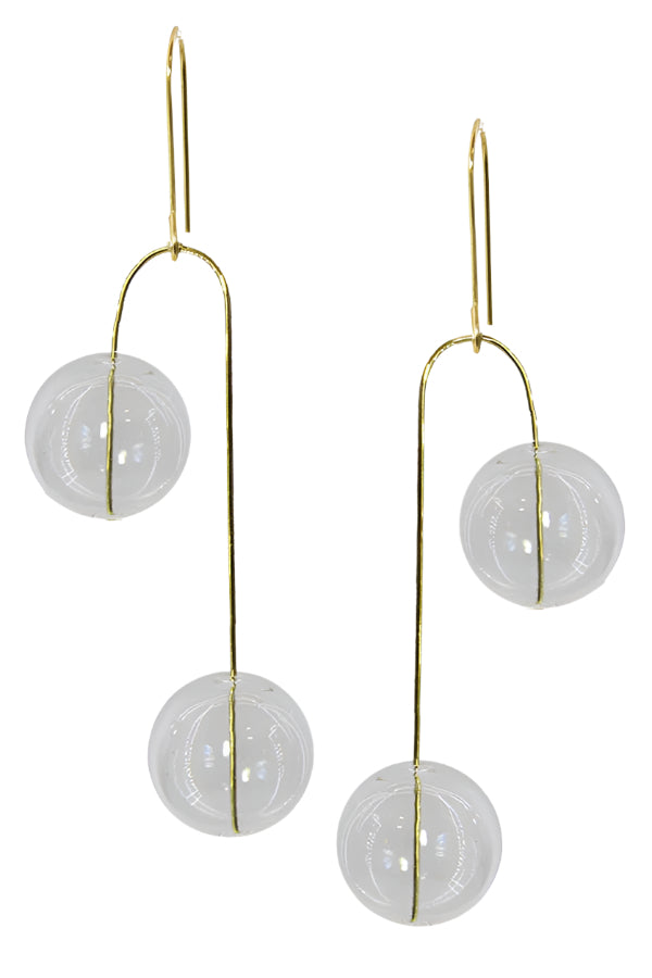 Gold earrings with circular designs on a white background