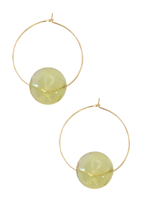 Gold hoop earrings with gold spherical glass beads on a white background