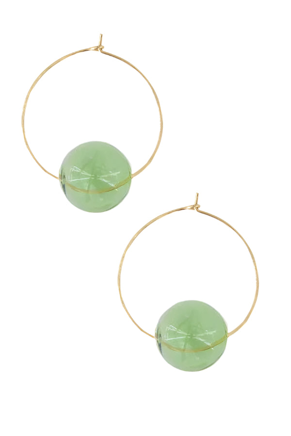 Gold hoop earrings with green spherical beads on a white background