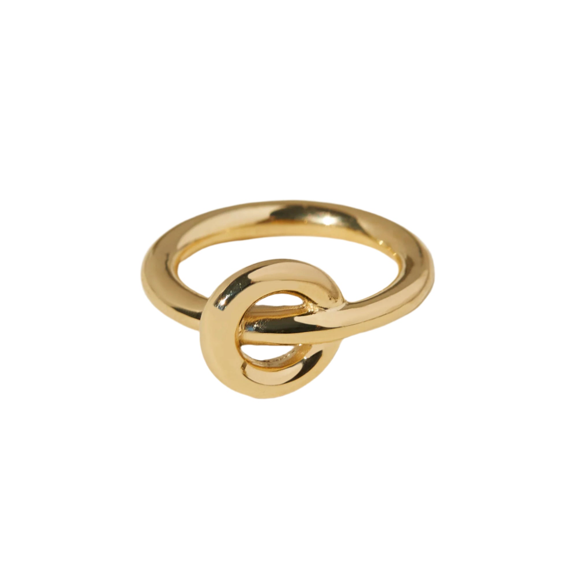 Gold knot ring on a white background
