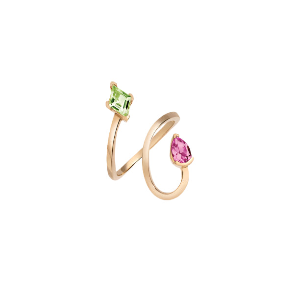 An open spiral wrap ring with a pear cut pink topaz and a lozenge cut peridot gemstone, made of gold vermeil.