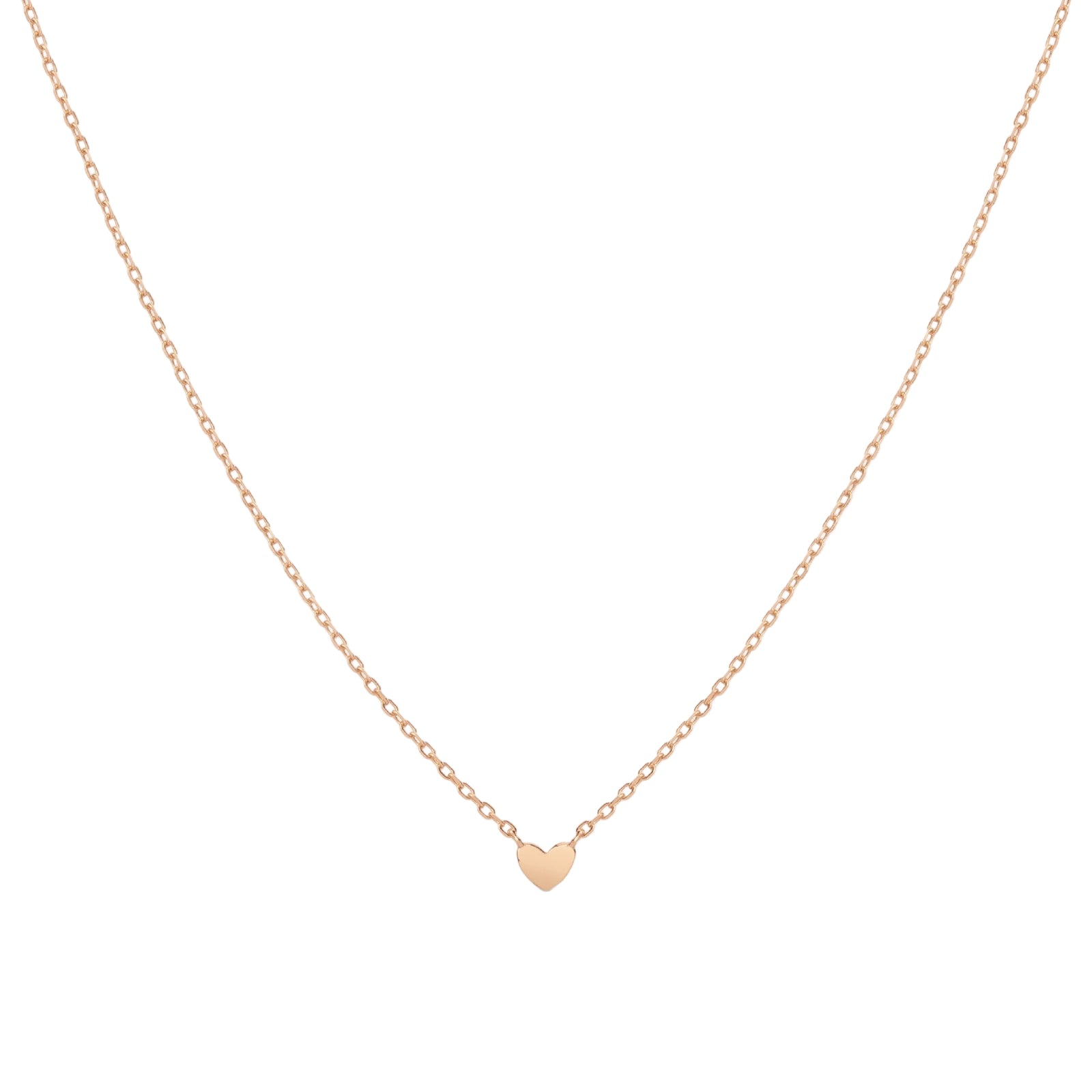 gold heart-shaped pendant necklace on a light beige background