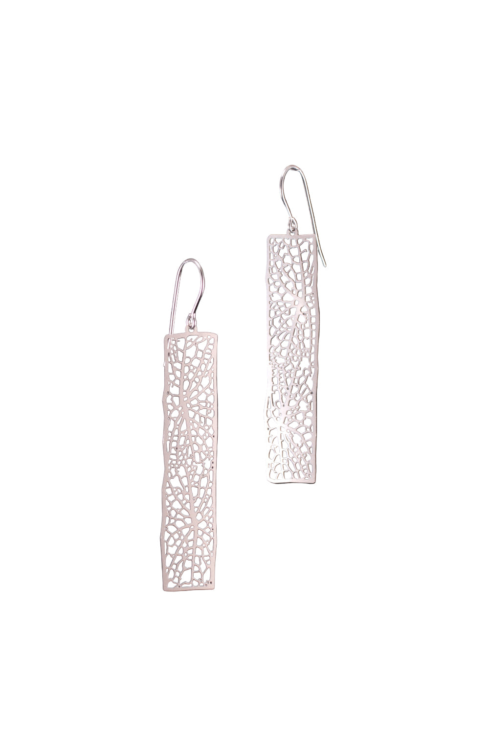 Pair of silver earrings with intricate designs on a white background